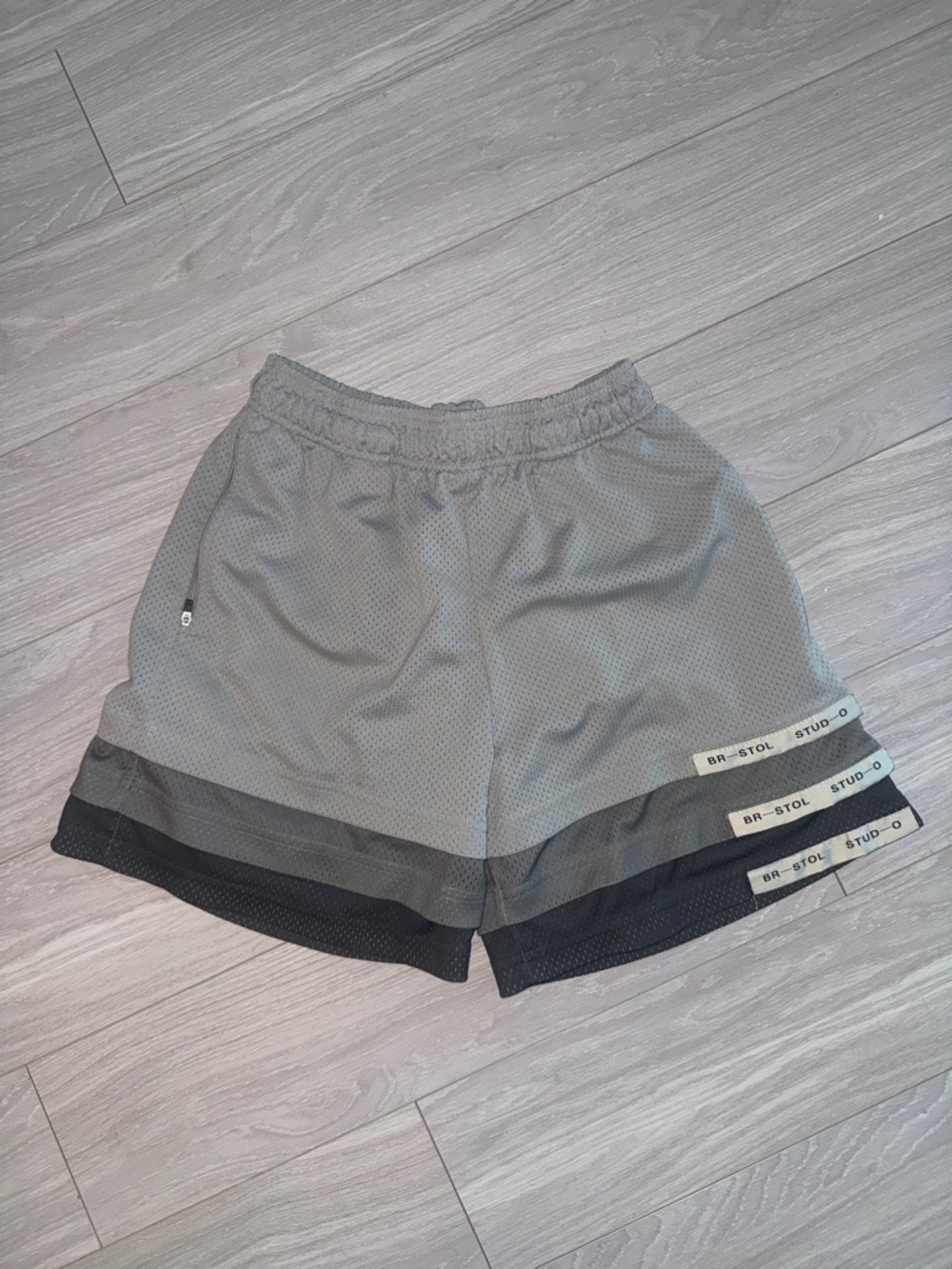 Men’s Gray Athletic Mesh Shorts with Layered Hem